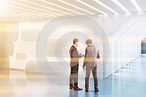 Futuristic white lobby, light wall, people