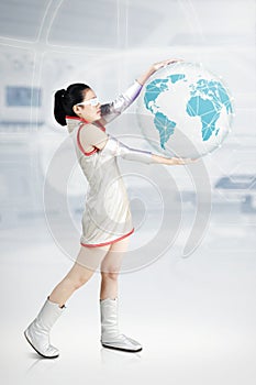 Futuristic woman holding a virtual globe