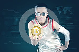 Futuristic woman showing bitcoin symbol