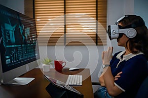 Futuristic women Engineer Wearing Virtual Reality Glasses working with a futuristic hologram to analysis and create alternative