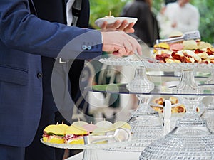 people self serve catering buffet finger food indoor in luxury location in Italy photo