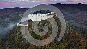 Fuzer, Hungary - 4K drone flying towards and above the Castle of Fuzer at the Zemplen Mountains on a cloudy autumn morning