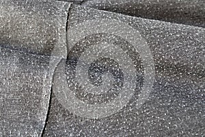 Fuzzball on the gray cotton knitwear fabric