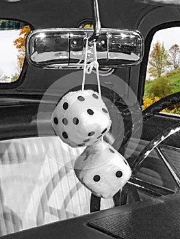 Fuzzy dice in old car