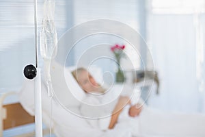 Fuzzy view of patient lying on her bed