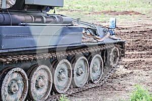 FV101 scorpion battle tank parked in muddy battlefield