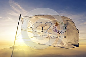 G20 2018 Argentina flag textile cloth fabric waving on the top sunrise mist fog