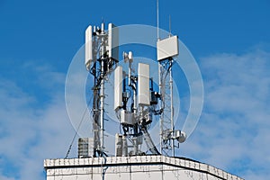 5G Cell Towers on sky background photo