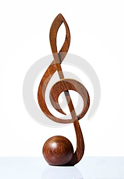 G-clef icon carved from wood