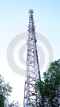 4G TV radio tower with parabolic antenna and satellite dish. Broadcast network signal. High coverage area.