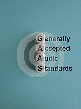 GAAS- generally accepted audit standards symbol. Concept words Generally Accepted Audit Standards on wooden cubes. Beautiful blue