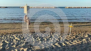 Gabicce, Pesaro Urbino, Italy . Sand and umbrellas at the beach of Gabicce Mare.