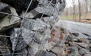 Gabion boxes protecting a river from erosion photo