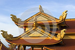 The gable of a Buddhist temple with the sea dragons. The surroundings of Phan Thiet