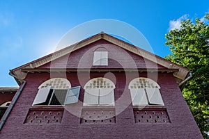 Gable roof, antique house with wooden windows