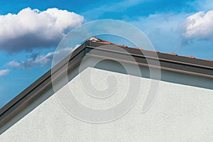 Gable roof, house roofing with sky in background