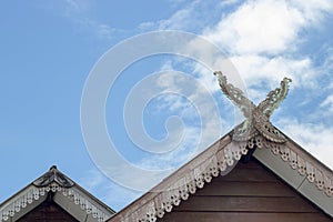 Gable roof house in Thai style and sky.
