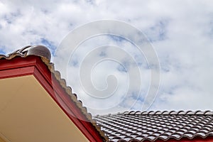 The gable roof with the sky with clouds background