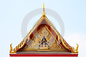 Gable roof on Thai temple with blue sky , Thailand