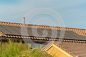 Gable style rooftop with photovoltaic or solar pannels to generate natural energy with the sun on tob of house or home