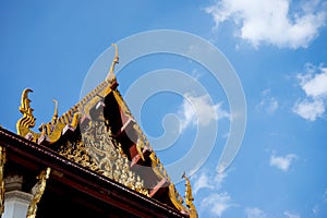 Gable wood thai temple blue sky cloud