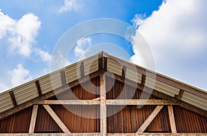 Gable of wooden houses and galvanized walls