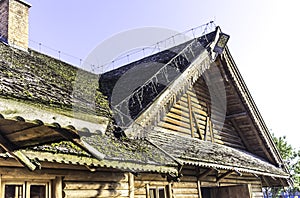 A gable wooden roof. Wooden decoration.