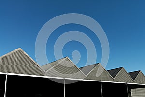 Gabled roof modern tin with blue sky