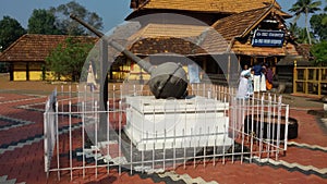 Gada or blunt mace at the indian temple of puliyoor photo