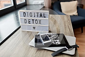 gadgets and digital detox words on light box