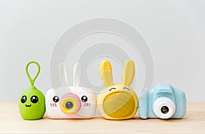 The gadgets for kids. Children\'s usefull toys: photo cameras, music speakers. White background