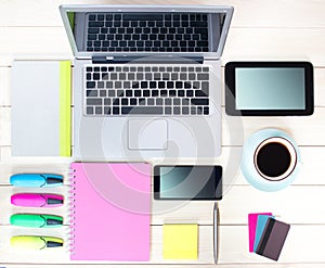 Gadgets on wooden background.Workplace upper view.