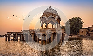 Gadisar lake at Jaisalmer, Rajasthan with ancient architecture at sunset