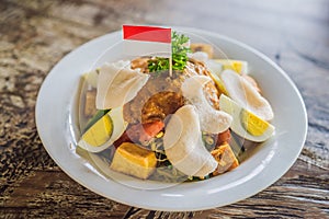 Gado-gado Indonesian salad served with peanut sauce. Ingredients: tofu, spinach, string beans, soy sprouts, potatoes