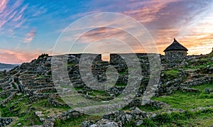 The Gaelic ruins at Castro de Santa Tecla in Galicia at sunrise photo