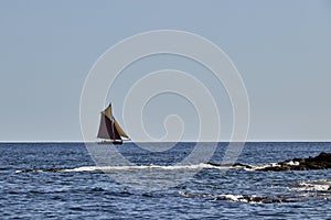 Gaff Rigged Sailing Boat on smooth sea