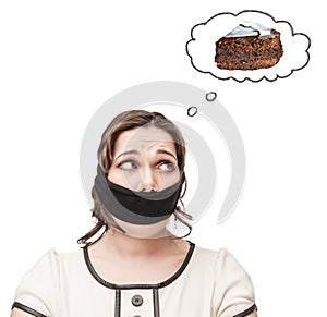 Gagged plus size woman dreaming about cake