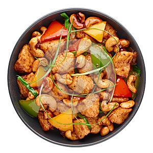 Gai Pad Med Mamuang or Thai Cashew Chicken in black bowl isolated on white. Kai Med Ma Muang is thai cuisine dish