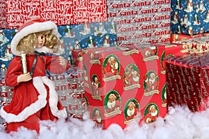 Gaily wrapped packages with dolls holding candles at holiday event, Sunnyside Gardens, Saratoga New York, 2019