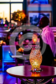 Gala Dinner or cocktail party Event Decor in dark room with candles and lamps