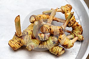 Galangal root on metal tray
