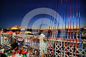 Galata Bridge (Istanbul  Turkey). Fishermans at night photo