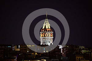 Galata Kulesi Tower at night in Istanbul, Turkey. Ancient Turkish famous landmark in Beyoglu district, European side of the city.