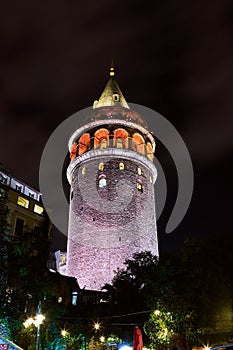 Galata Kulesi Tower at night in Istanbul, Turkey. Ancient Turkish famous landmark in Beyoglu district, European side of the city.