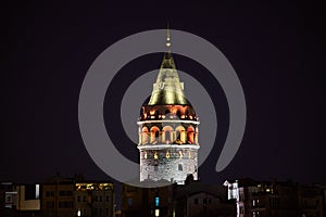 Galata Kulesi Tower at night in Istanbul, Turkey. Ancient Turkish famous landmark in Beyoglu district, European side of the city.