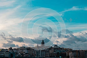 Galata Tower and Karakoy district view with partly cloudy sky