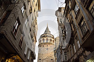 The Galata Tower lit by the setting sun in Istanbul, Turkey
