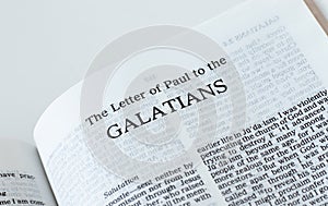 Galatians open Holy Bible Book isolated on white background photo