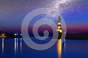 Galaxy over the Lighthouse of Chania at ummer sunset , Crete , Greece.