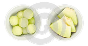Galia melon slices and balls, fresh and ripe sarda melon in white bowls photo